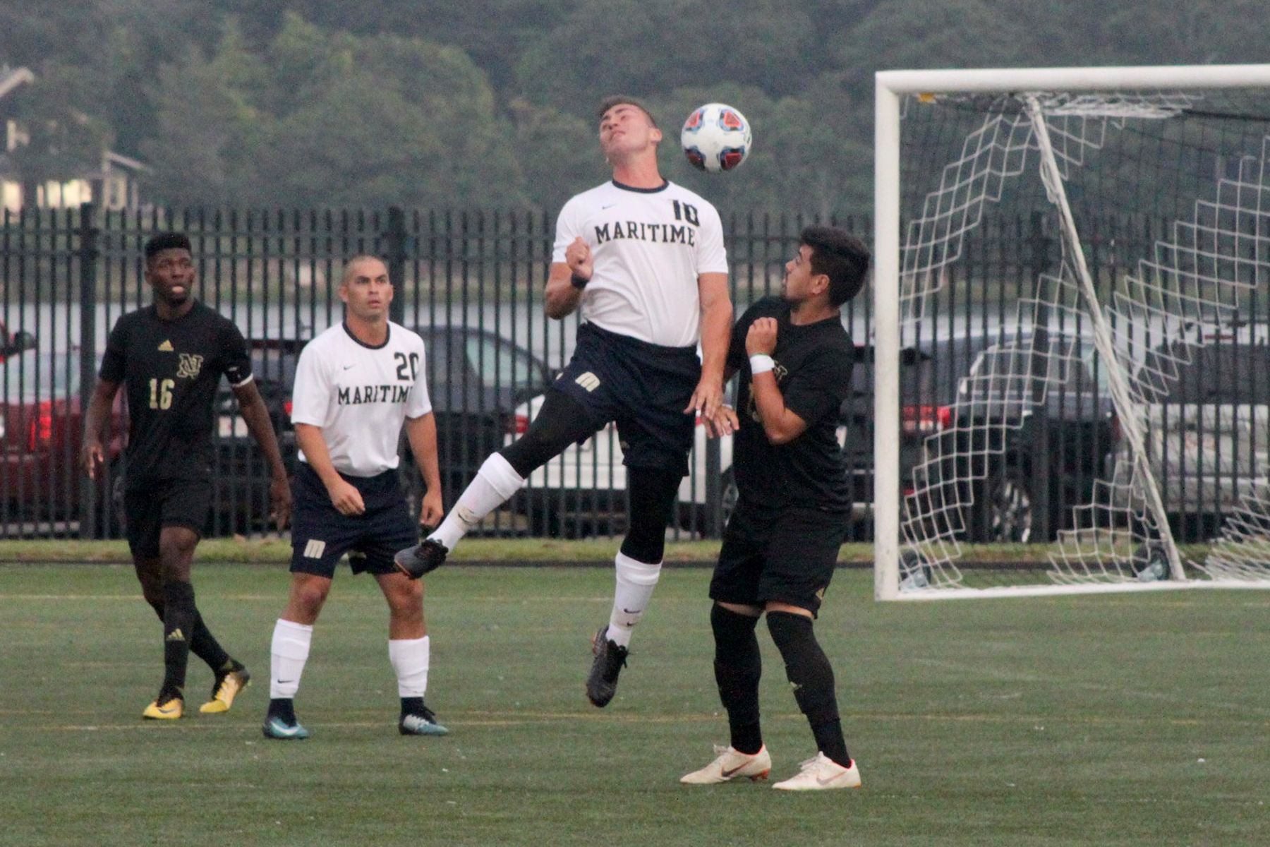 Andrew Wayrynen puts a head on the ball.