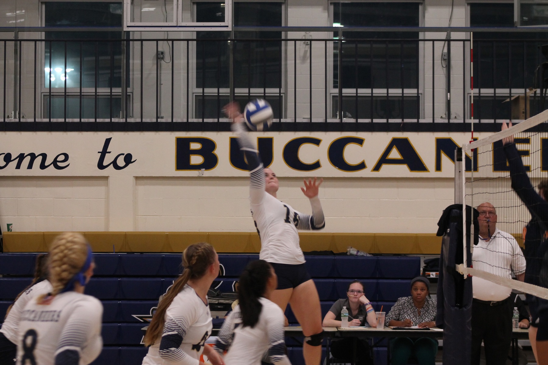 Jen Roy fires the ball over the net for the Bucs